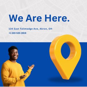 Man smiling and pointing toward location pin with text “We Are Here – 134 East Tallmadge Ave, Akron, OH