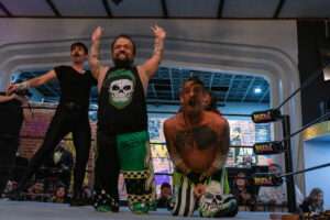 Wrestlers celebrate victory during live wrestling events at Royal Palace Akron.