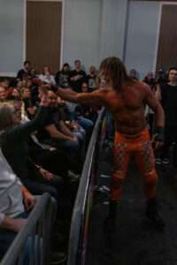 Wrestler engaging with fans during live wrestling events at Royal Palace Akron