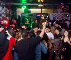 Crowded dance floor at Bollywood Night in Akron Ohio inside Royal Palace event venue.