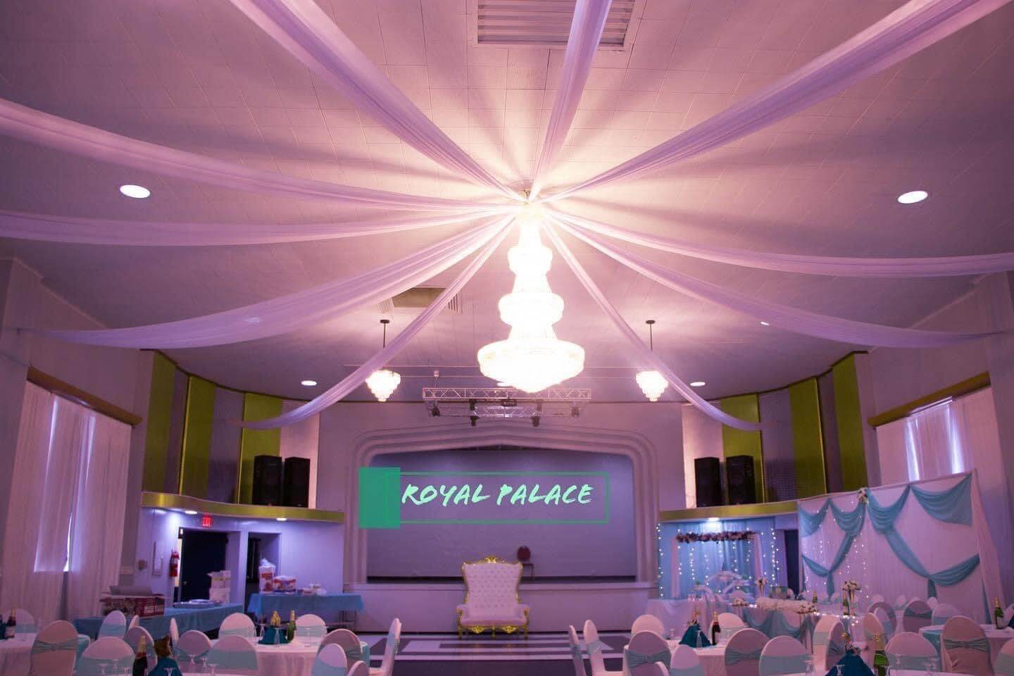 Elegant bridal shower hall interior at Royal Palace Akron with chandelier and draped ceiling
