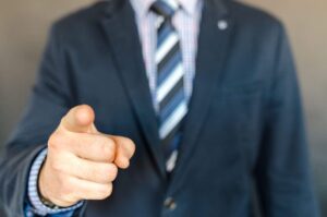 Business professional pointing, ready to book a corporate event